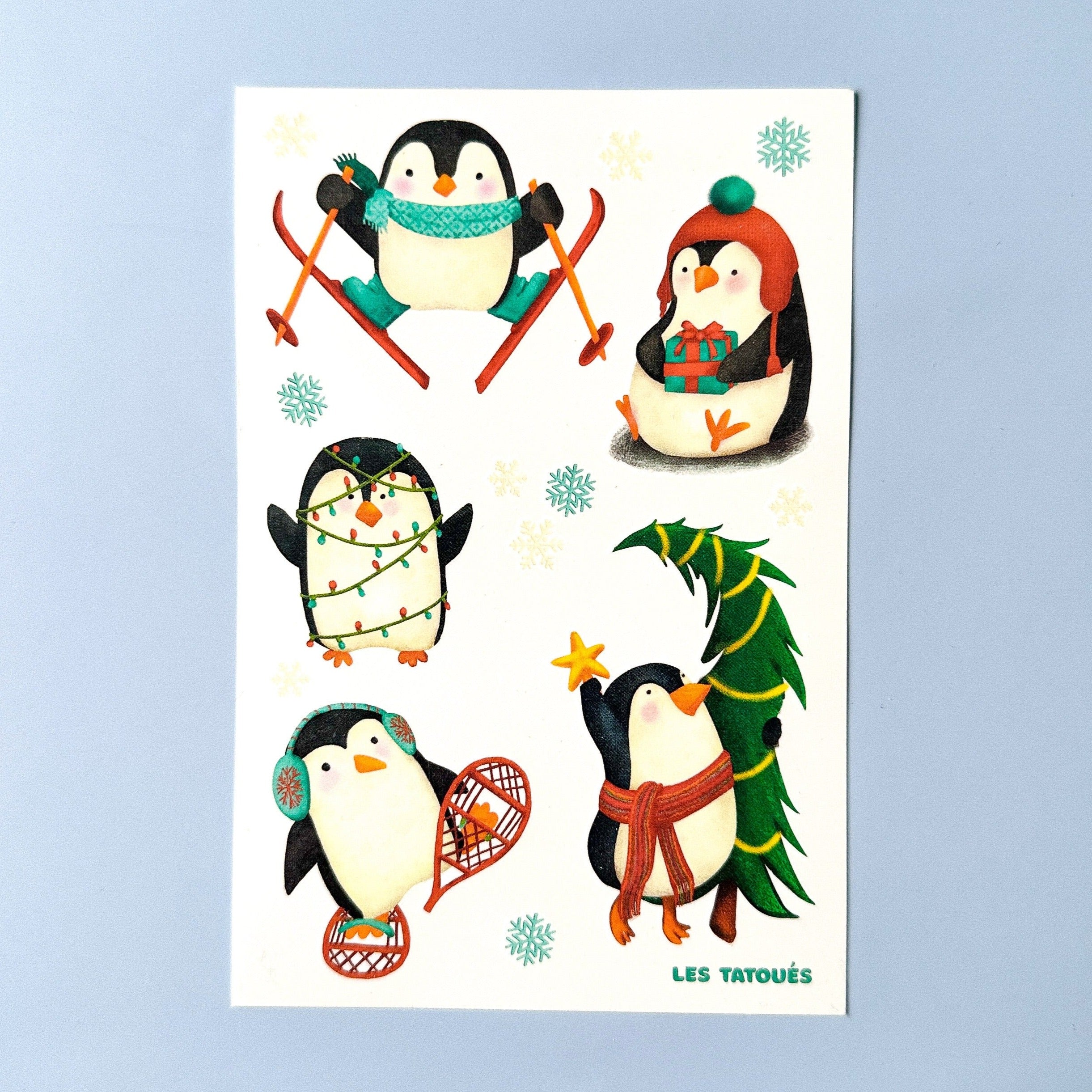 Tatouages de pingouins du temps des fêtes
